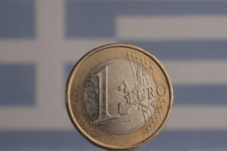 A closeup shot of a Euro coin on a blurred backgroundの写真素材