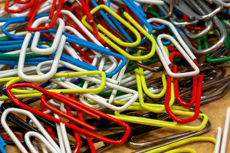 A closeup shot of colorful clips on a craft paper backgroundの写真素材