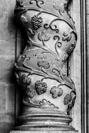 A closeup monochrome shot of twisted columns of the Maria Santissima Cathedral, in Ortigia, Italy