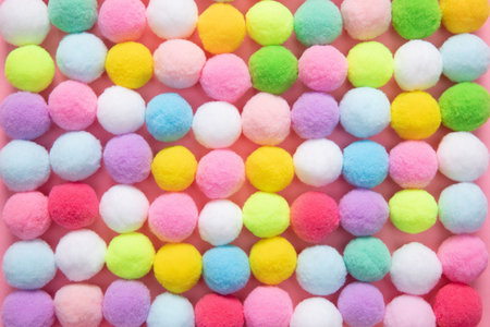 A closeup shot of colorful soft pom pom balls
