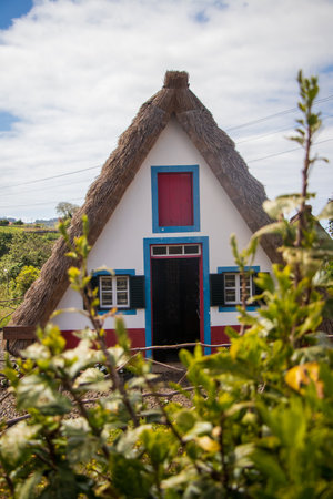 A vertical shot of a traditional House in Santana, Portugalの写真素材