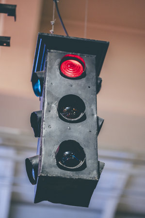 A vertical shot of a traffic light showing stop