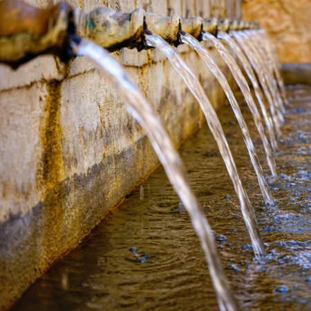 The water flowing from the vintage fountains