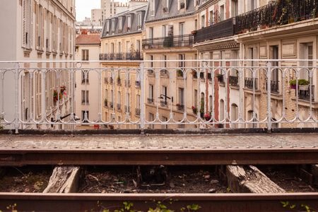 A beautiful shot of vintage European buildings near train tracksの写真素材