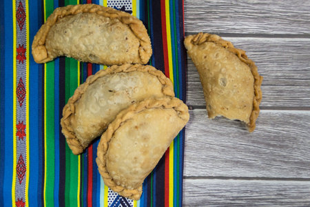 Typical Argentine fried meat empanadas, on rustic backgroundの写真素材