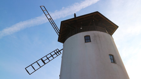 A low angle shot of a windmill under the skyの写真素材