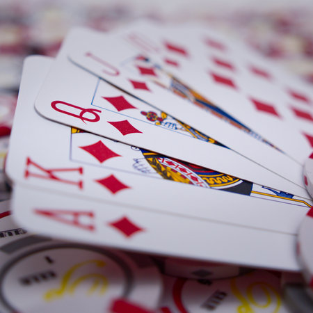 A selective focus shot of poker cards and chipsの写真素材