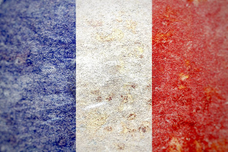 A closeup shot of the flag of France faded on a grungy wallの写真素材