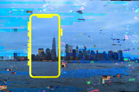 A cityscape seen through an outline of a phone with digital tech lines - smart city network conceptの写真素材