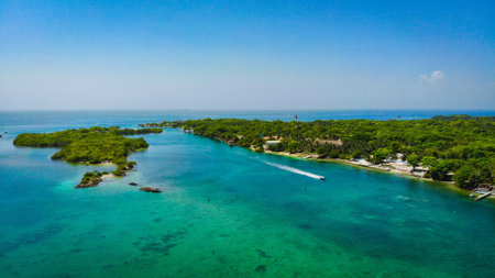 created by dji camera aerial view of a boat cruising the waters outside of cartagena colombiaの写真素材