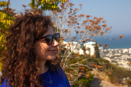 A Caucasian female with sunglasses outdoorsの写真素材