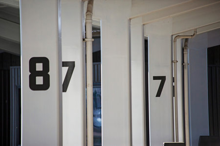 A closeup shot of numbers on metal columns