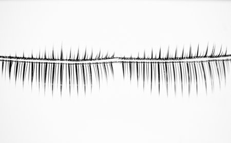 A grayscale shot of a metallic decoration piece on a white backgroundの写真素材