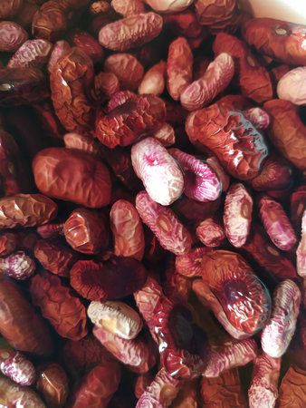 Red beans in different sizes and shades of red.