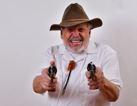 An angry senior man aiming two revolvers