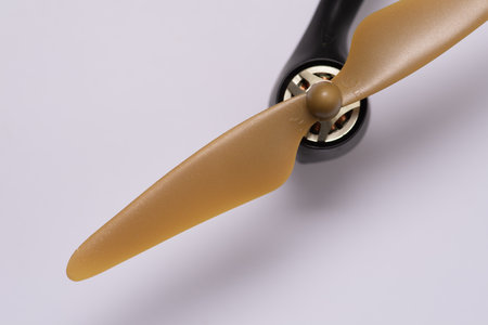 A closeup of a brown drone propeller isolated on white backgroundの写真素材
