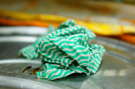 Green cleaning cloth by a sinkの写真素材