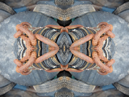 An abstract symmetric pattern of pipes and metal chains