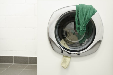 Socks Hanging Out From the Washing Machine Door in Switzerland.
