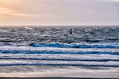 A breathtaking view of the calm sea at sunsetの写真素材