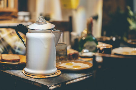A coffee pot on a breakfast tableの写真素材
