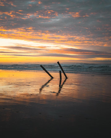 A beautiful view at the golden sunset on the beachの写真素材