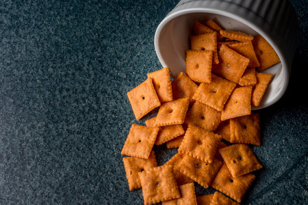 The poured out crackers from the bowlの写真素材