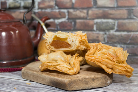 Plate of fried sweet potato and quince pastries. traditional in the Argentine national holidaysの写真素材