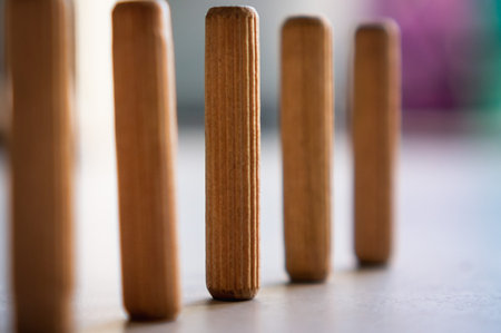 A selective focus of wooden sticks in a row for childrenの写真素材