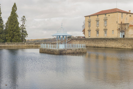 A closeup shot of a small lake in the city park in Bejar, Salamanca, Spainの写真素材