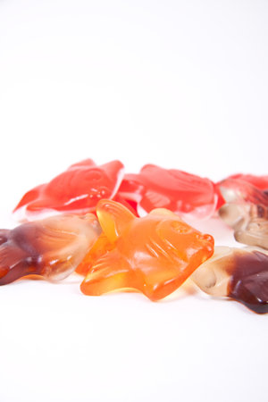 Fresh gelatine candies on a white surfaceの写真素材