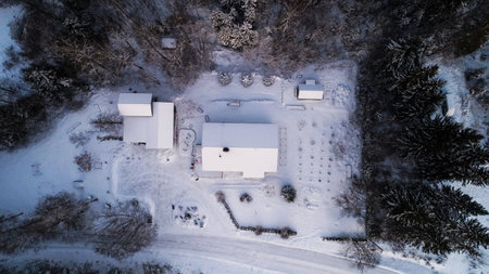 Aerial view above a detached house, winter evening - top down, drone shot