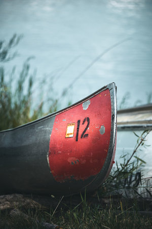 A closeup shot of an old rusty canoe on a blurred background