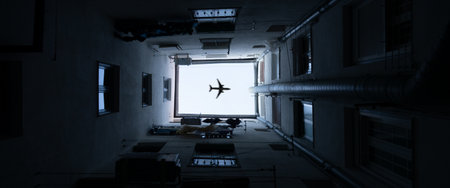 A top view shot of a flying plane over the builの写真素材