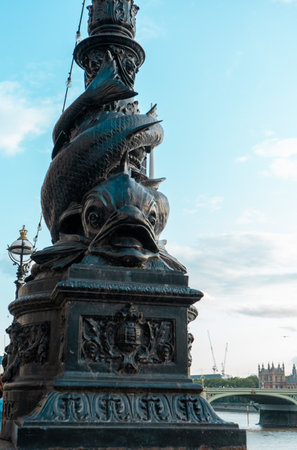 A vertical shot of the Dolphin Lamp Post in Londonの写真素材