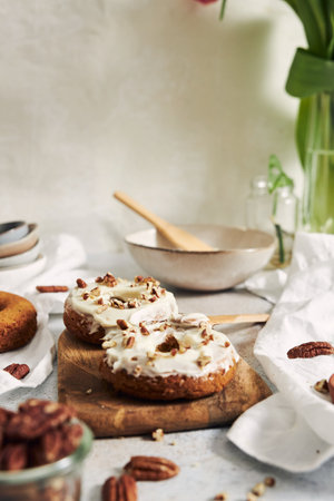 A vertical shot of delicious carrot pastries with cream and nutsの写真素材
