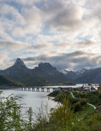 A vertical shot of mountain landscape over the Riano reservoir in Spainの写真素材
