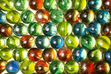 A closeup shot of colorful shiny marblesの写真素材