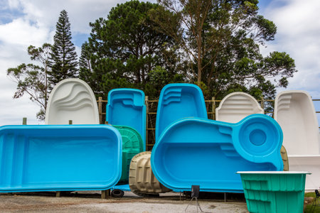 Various fiberglass pools in different shapes and colorの写真素材