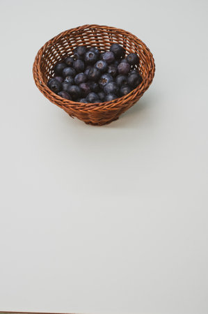 A closeup shot of blueberries in a basketの写真素材