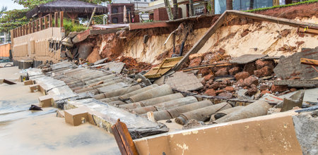 A destructed part of a street caused by high tide wavesの写真素材