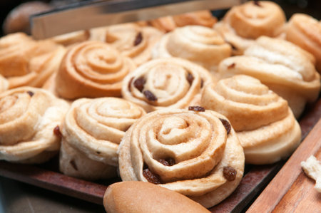 A closeup shot of fresh cinnabons with raisins
