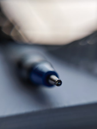A selective focus shot of a ballpoint pen in verticalの写真素材