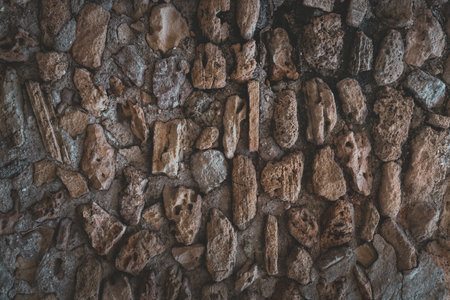 A seamless dark stone wall texture for wallpaper or backgroundの写真素材