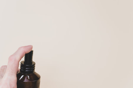 A closeup shot of a brown transparent spray bottleの写真素材
