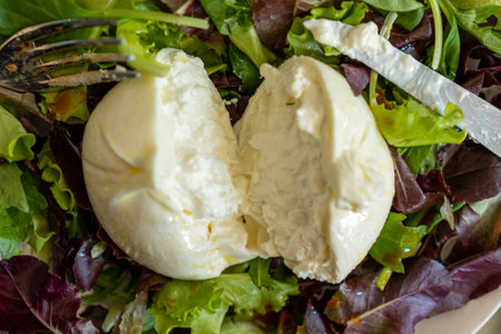 A closeup shot of mozzarella on a salad