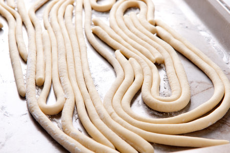 a tray of hand rolled pci pasta made from scratchの写真素材