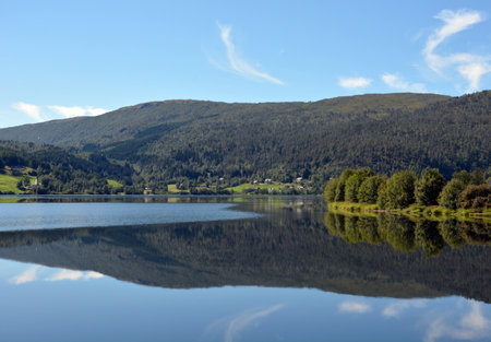 A beautiful shot of a mountain lake with treesの写真素材