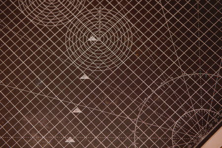 A closeup shot of a professional cutting mat with measuring scales