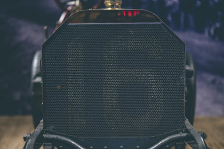 A closeup shot of a number 16 on the black metal backgroundの写真素材